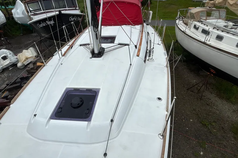 Statira Yacht Photos Pics 2017 Jeanneau Sun Odyssey 389 sailboat on land, surrounded by other boats.