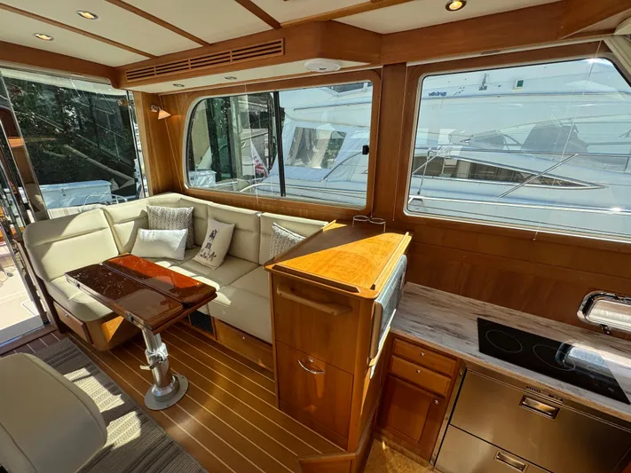  Yacht Photos Pics Luxurious interior of 2019 Sabre 42 Salon Express yacht with elegant wood finishes.