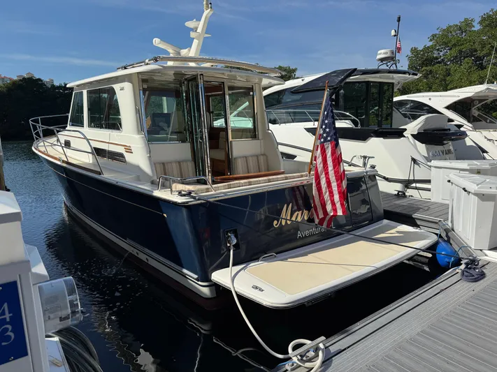  Yacht Photos Pics 2019 Sabre 42 Salon Express yacht docked, featuring a sleek design and American flag.