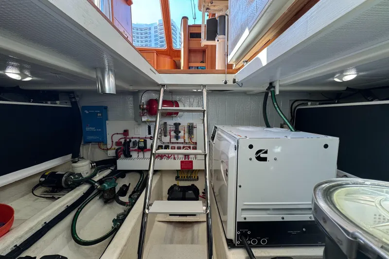  Yacht Photos Pics Engine room of 2019 Sabre 42 Salon Express with equipment and ladder access.