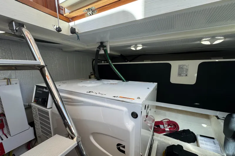  Yacht Photos Pics Engine room of 2019 Sabre 42 Salon Express yacht, featuring equipment and storage.