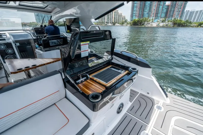  Yacht Photos Pics 2026 Granfort 37 GTX luxury yacht interior with grill and scenic waterfront view.