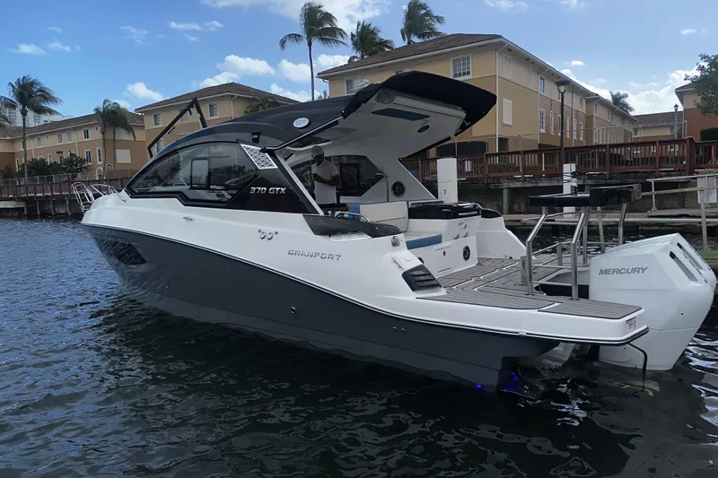  Yacht Photos Pics 2026 Granfort 37 GTX luxury boat docked by waterfront homes.