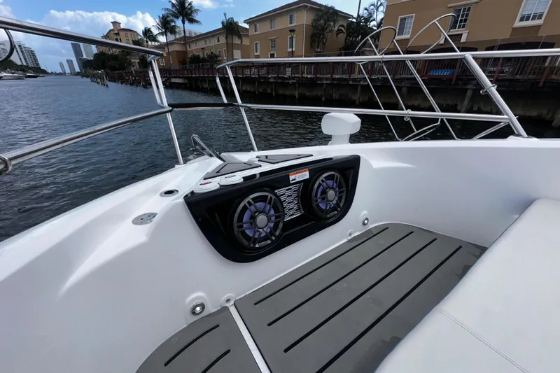  Yacht Photos Pics Granfort 37 GTX 2026 boat deck with speakers, docked near waterfront homes.