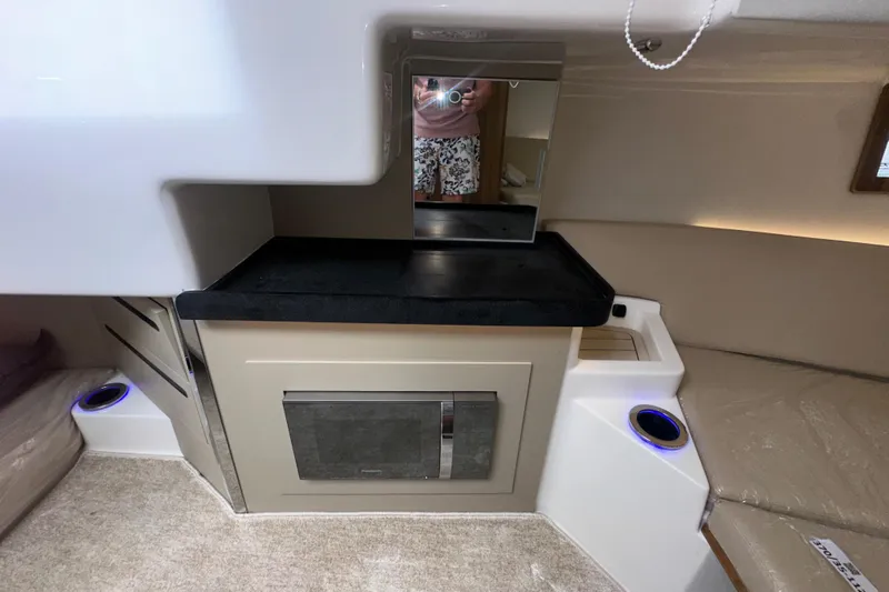  Yacht Photos Pics Interior of 2026 Granfort 37 GTX boat with modern kitchenette and seating area.