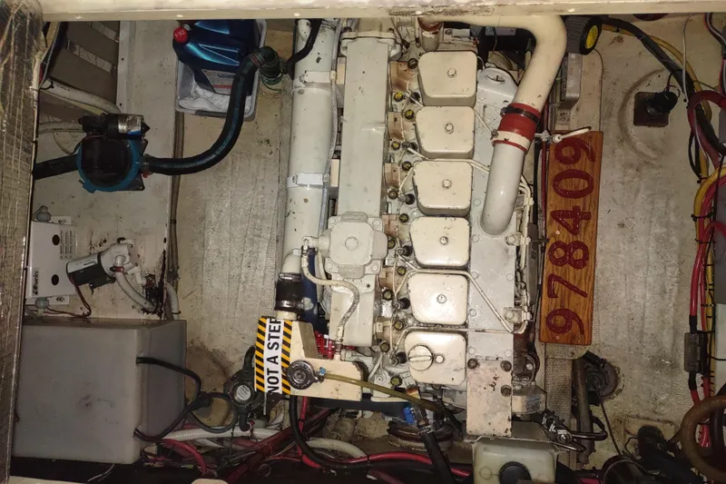 Dobro Yacht Photos Pics Engine compartment of a 1990 Nordic Tug 32, showcasing mechanical components and wiring.