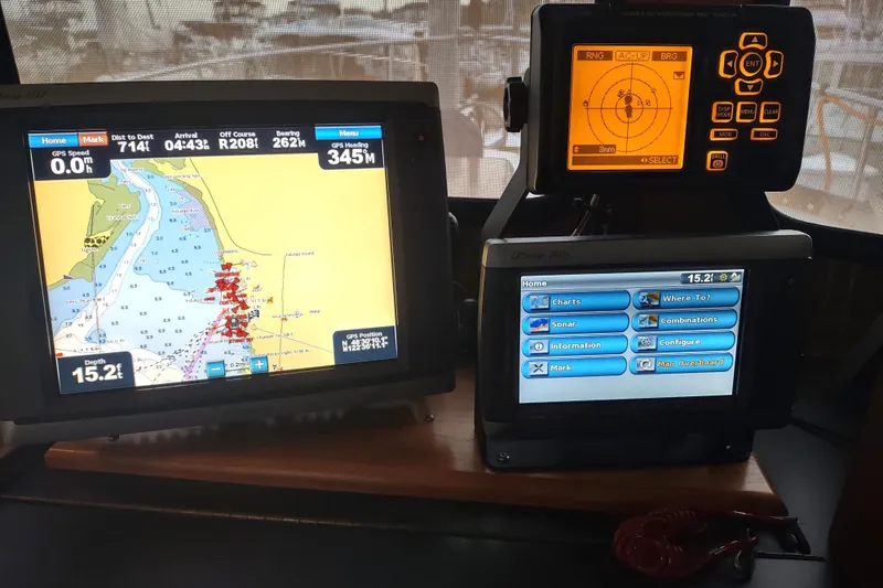 Dobro Yacht Photos Pics Navigation equipment on a 1990 Nordic Tug 32, featuring GPS and radar displays.