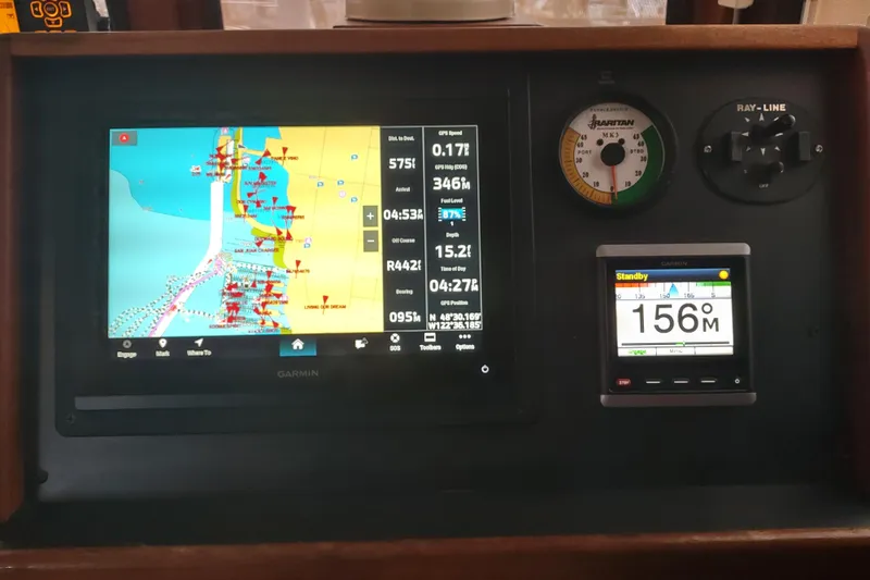 Dobro Yacht Photos Pics Navigation dashboard of a 1990 Nordic Tug 32 with Garmin display and instruments.
