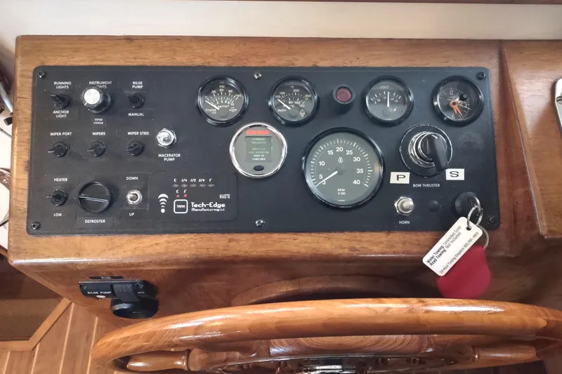 Dobro Yacht Photos Pics Control panel of a 1990 Nordic Tug 32 with gauges and switches.
