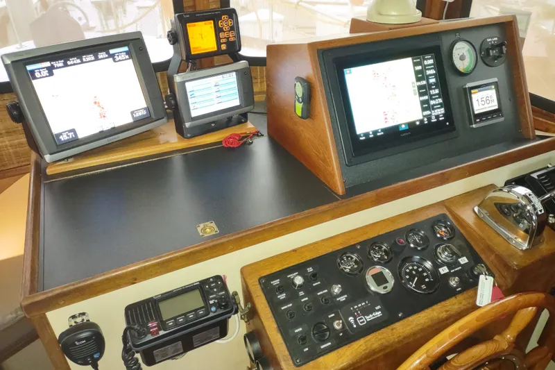 Dobro Yacht Photos Pics Control panel of a 1990 Nordic Tug 32 with navigation and communication equipment.