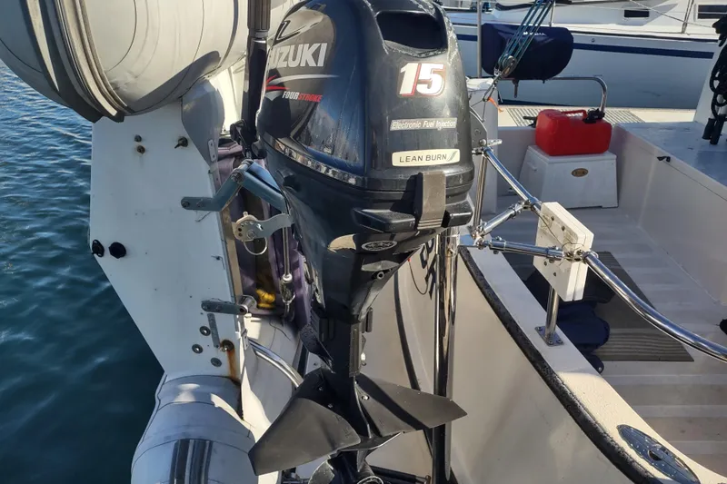 Dobro Yacht Photos Pics Outboard motor on a 1990 Nordic Tug 32, featuring Suzuki four-stroke engine.