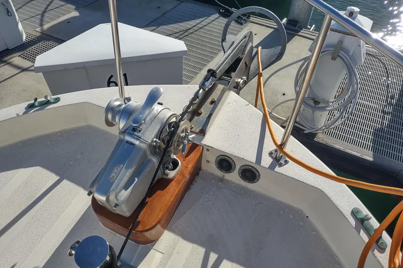 Dobro Yacht Photos Pics Anchor winch on 1990 Nordic Tug 32 boat at dockside.