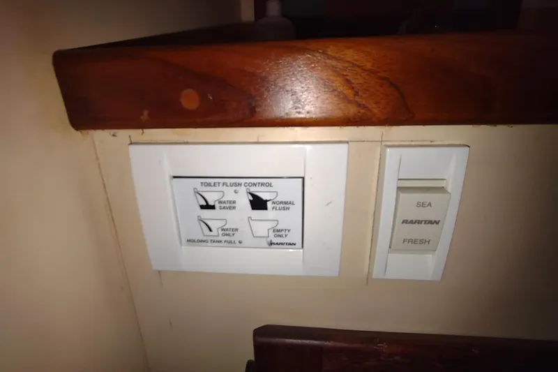 Dobro Yacht Photos Pics Toilet flush control panel on a 1990 Nordic Tug 32 boat.