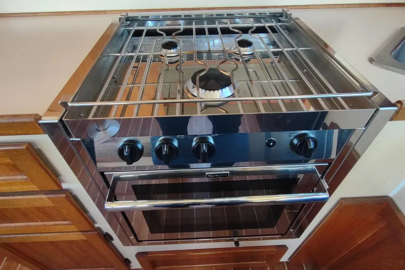 Dobro Yacht Photos Pics Stainless steel stove and oven in 1990 Nordic Tug 32 boat kitchen.