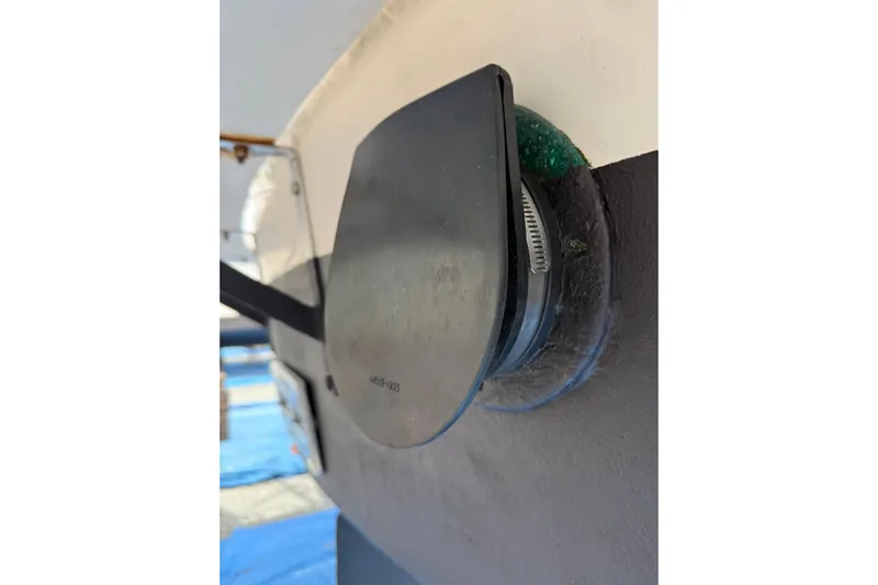 Dobro Yacht Photos Pics Close-up of a 1990 Nordic Tug 32 hull detail with protective cover.