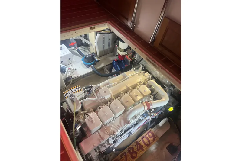 Dobro Yacht Photos Pics Engine compartment of a 1990 Nordic Tug 32, showcasing detailed mechanical components.