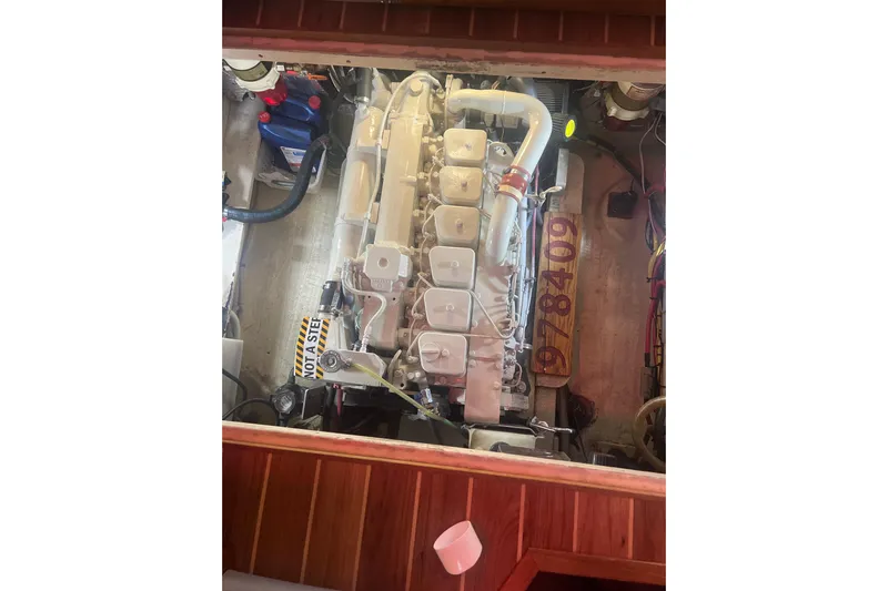 Dobro Yacht Photos Pics Engine compartment of a 1990 Nordic Tug 32, showcasing detailed mechanical components.