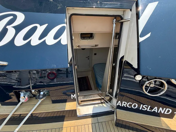 Bad Bettye Yacht Photos Pics 2006 Marquis 65 yacht entrance with open door, showcasing interior cabin access.