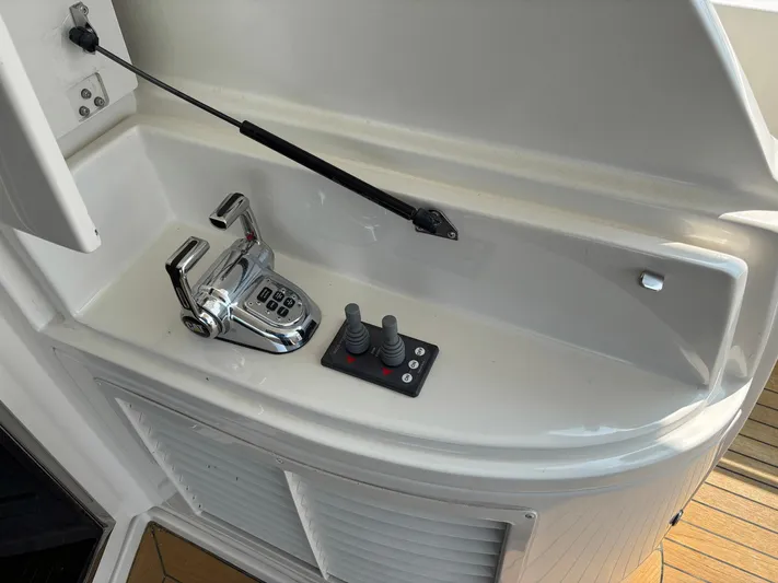 Bad Bettye Yacht Photos Pics Control panel of a 2006 Marquis 65 yacht with throttle and joystick controls.