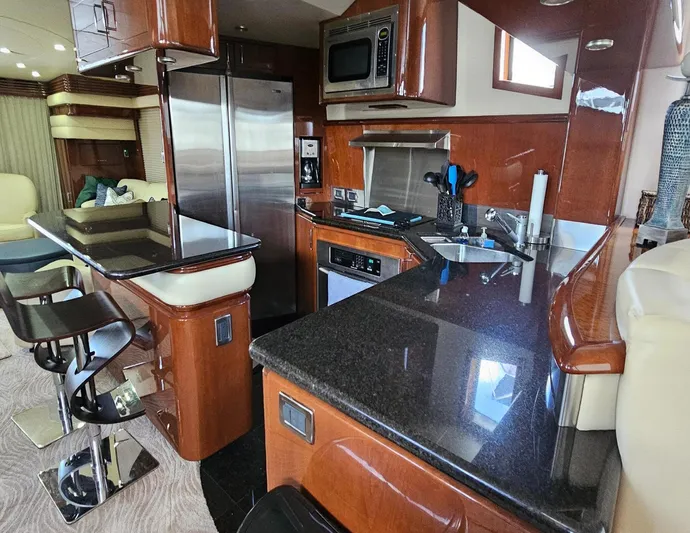 Bad Bettye Yacht Photos Pics Luxurious 2006 Marquis 65 yacht kitchen with modern appliances and sleek countertops.
