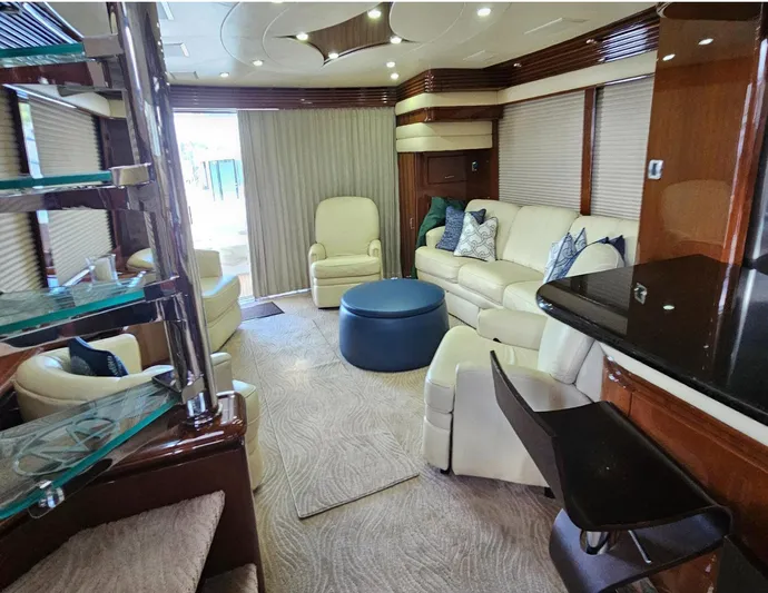 Bad Bettye Yacht Photos Pics Luxurious interior of a 2006 Marquis 65 yacht with elegant seating and modern decor.