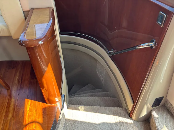 Bad Bettye Yacht Photos Pics Staircase in 2006 Marquis 65 yacht with polished wood and carpeted steps.