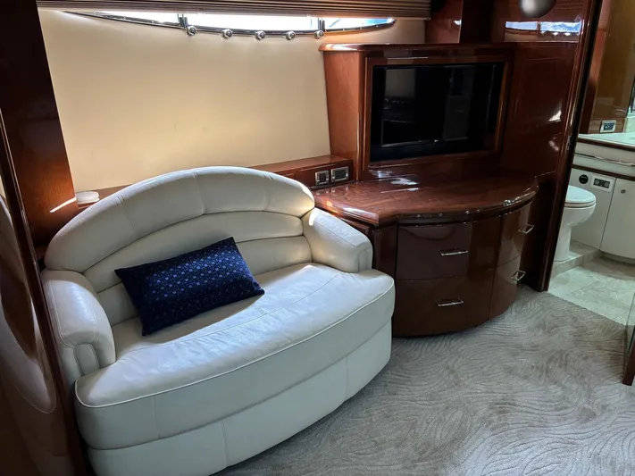 Bad Bettye Yacht Photos Pics Luxurious interior of 2006 Marquis 65 yacht with plush seating and entertainment area.