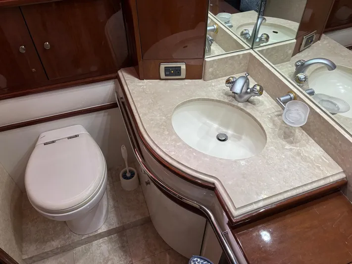 Bad Bettye Yacht Photos Pics Luxury bathroom in 2006 Marquis 65 yacht with elegant fixtures and marble countertop.