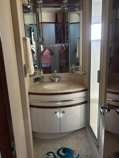 Bad Bettye Yacht Photos Pics Luxurious bathroom in 2006 Marquis 65 yacht with elegant fixtures and mirrored cabinetry.