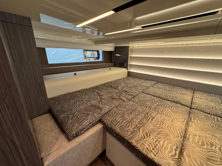  Yacht Photos Pics 2024 Cranchi A46 Luxury Tender interior cabin with elegant bedding and modern design.