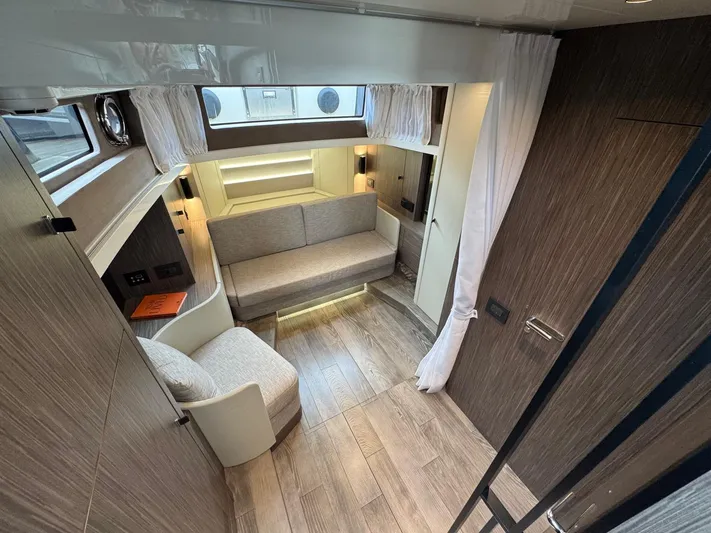  Yacht Photos Pics 2024 Cranchi A46 Luxury Tender interior with modern seating and wood accents.