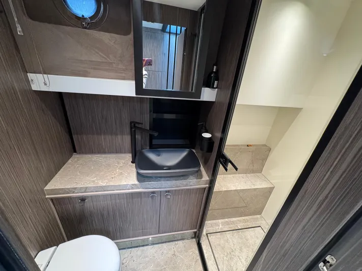  Yacht Photos Pics 2024 Cranchi A46 Luxury Tender bathroom with modern fixtures and elegant design.