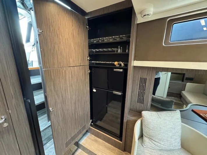  Yacht Photos Pics 2024 Cranchi A46 Luxury Tender interior with open cabinet and modern design.