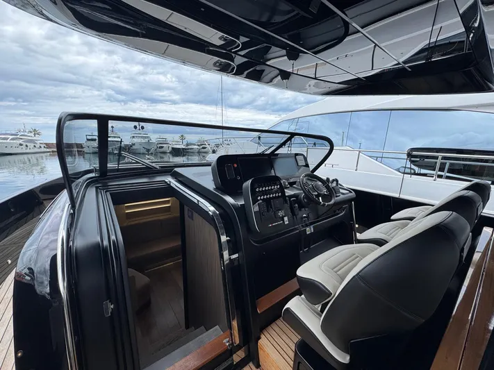  Yacht Photos Pics 2024 Cranchi A46 Luxury Tender cockpit with modern controls and plush seating.