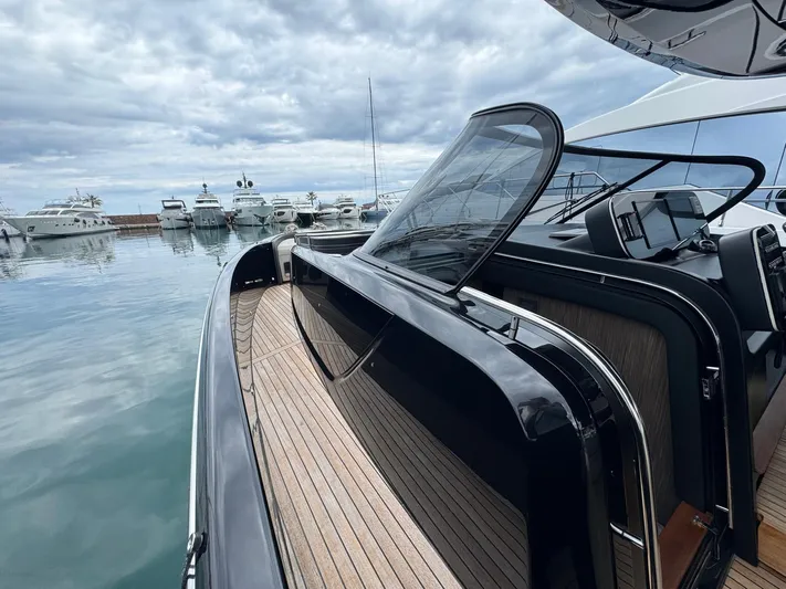  Yacht Photos Pics 2024 Cranchi A46 Luxury Tender docked, showcasing sleek design and spacious deck.