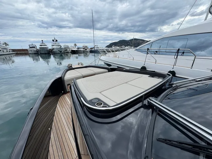  Yacht Photos Pics 2024 Cranchi A46 Luxury Tender docked, showcasing sleek design and spacious deck.