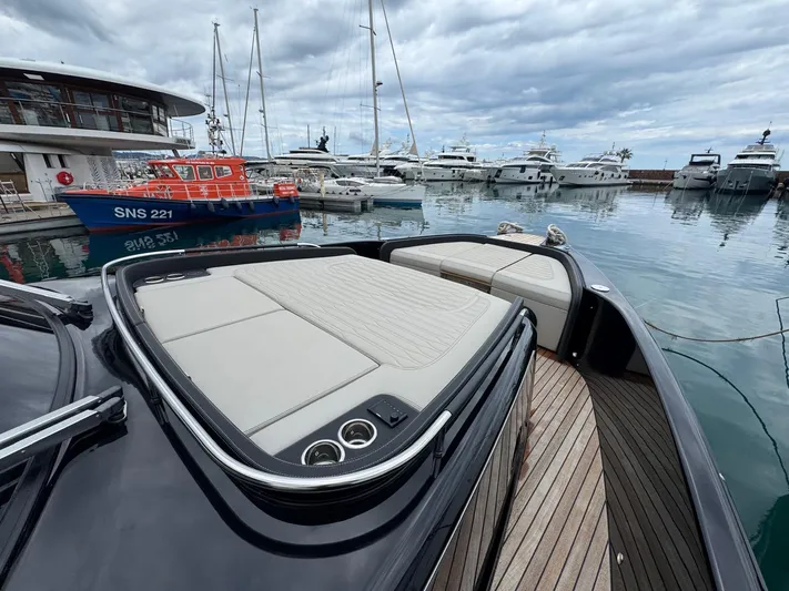  Yacht Photos Pics 2024 Cranchi A46 Luxury Tender docked at marina, showcasing sleek design and spacious deck.