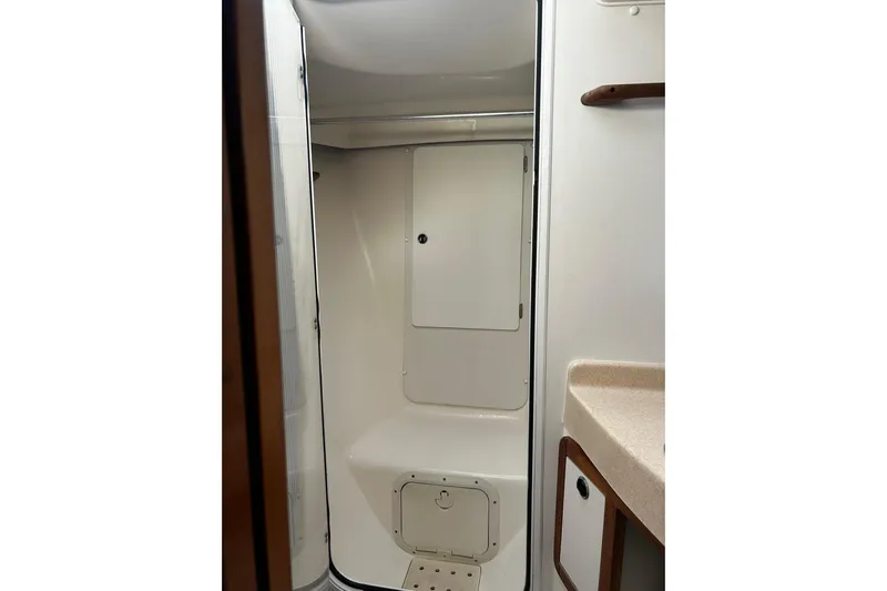 Simpatico Yacht Photos Pics 1999 Catalina 42 MkII yacht bathroom with shower and storage compartments.