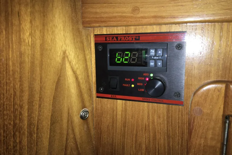 Simpatico Yacht Photos Pics Sea Frost control panel on 1999 Catalina 42 MkII yacht, mounted on wooden surface.