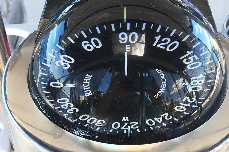 Simpatico Yacht Photos Pics Compass on a 1999 Catalina 42 MkII sailboat, showing east direction.