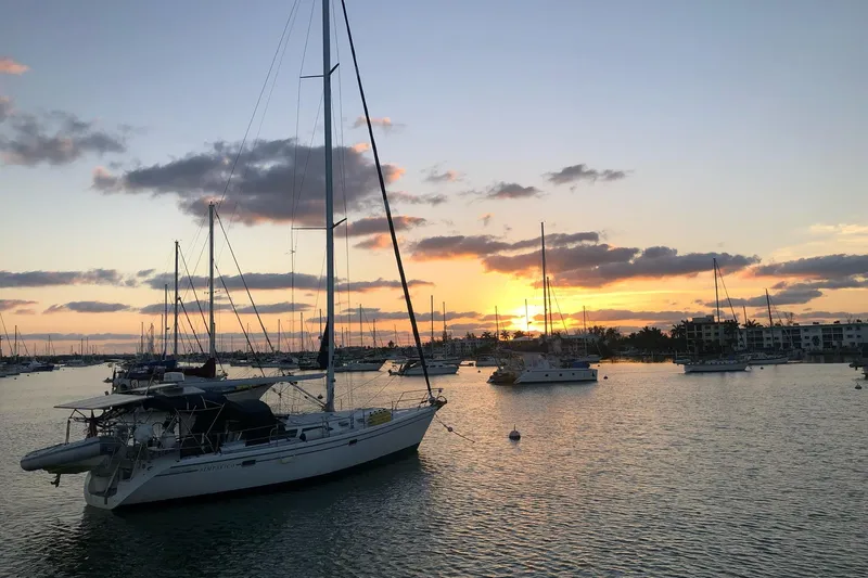Simpatico Yacht Photos Pics Sailboats anchored at sunset, featuring a 1999 Catalina 42 MkII.