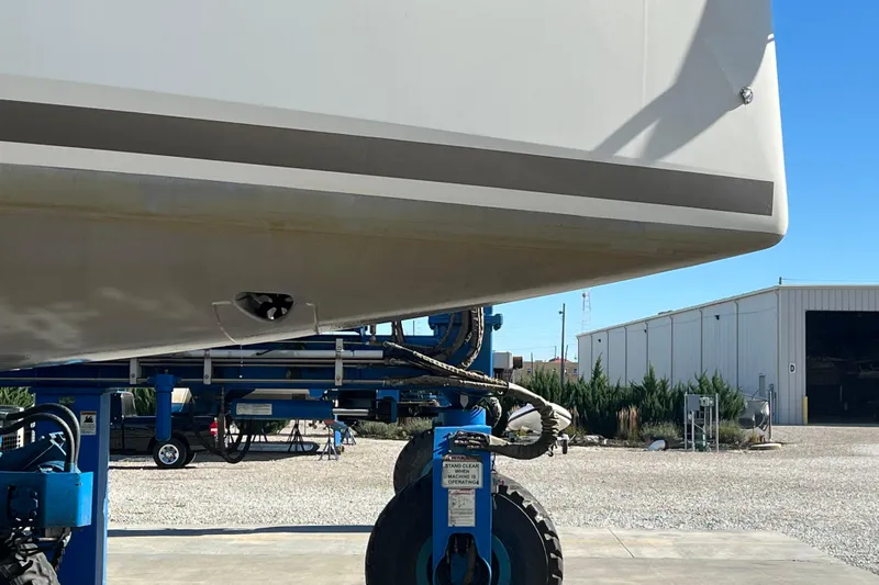 Job Site Yacht Photos Pics 2023 Jeanneau Sun Odyssey 380 yacht on a lift, showcasing hull details.