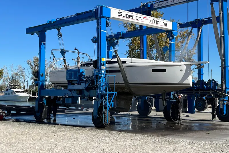 Job Site Yacht Photos Pics 2023 Jeanneau Sun Odyssey 380 sailboat lifted by Superior Marine crane.