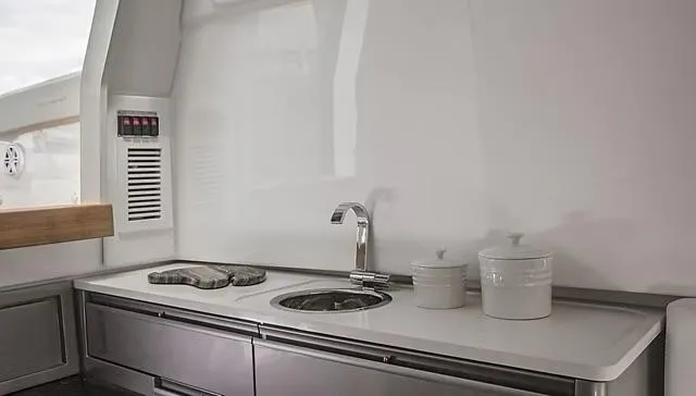  Yacht Photos Pics Modern kitchen area on 2025 Schaefer V33 yacht with sleek countertop and sink.