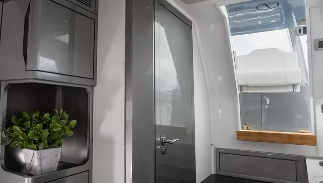  Yacht Photos Pics Interior of 2025 Schaefer V33 yacht with modern design and potted plant.