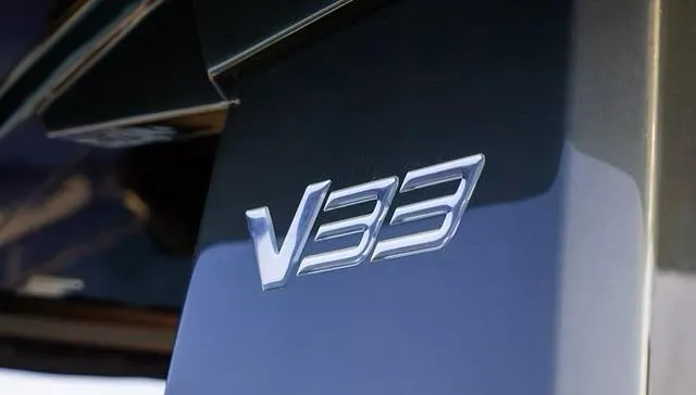  Yacht Photos Pics Close-up of 2025 Schaefer V33 model emblem on a sleek surface.