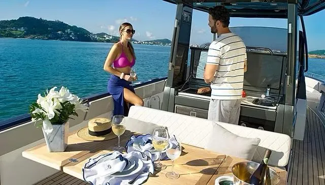  Yacht Photos Pics Couple enjoying leisure time on a 2025 Schaefer V33 yacht, with scenic ocean views.