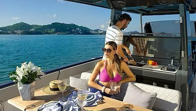  Yacht Photos Pics Couple enjoying leisure time on Schaefer V33 yacht, 2025 model, with scenic ocean view.