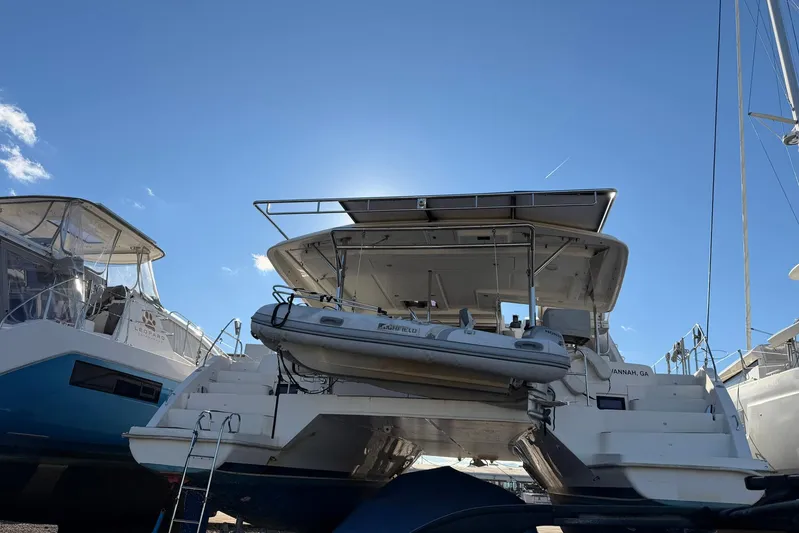 Gratitude Yacht Photos Pics 2015 Leopard 48 catamaran docked under clear blue sky, rear view.