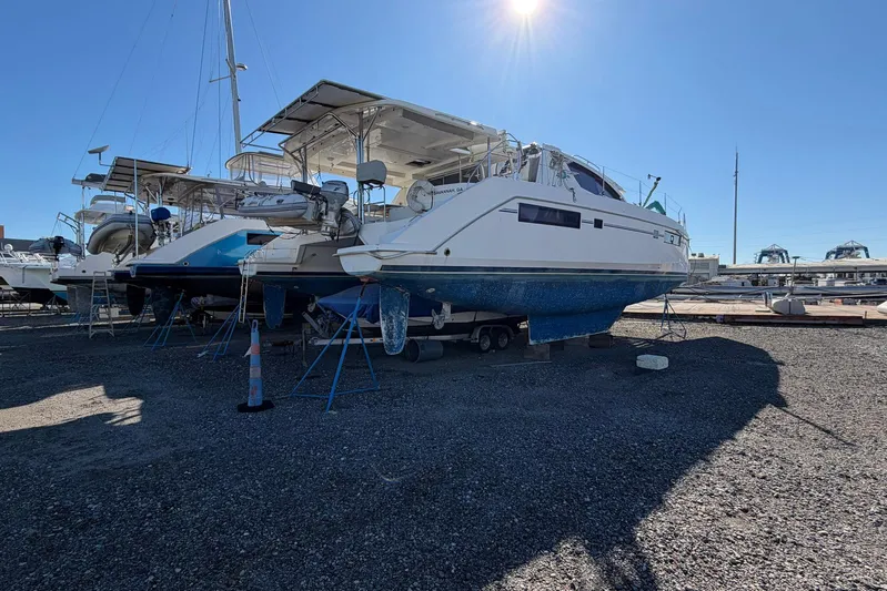 Gratitude Yacht Photos Pics 2015 Leopard 48 catamaran on dry dock under clear blue sky.